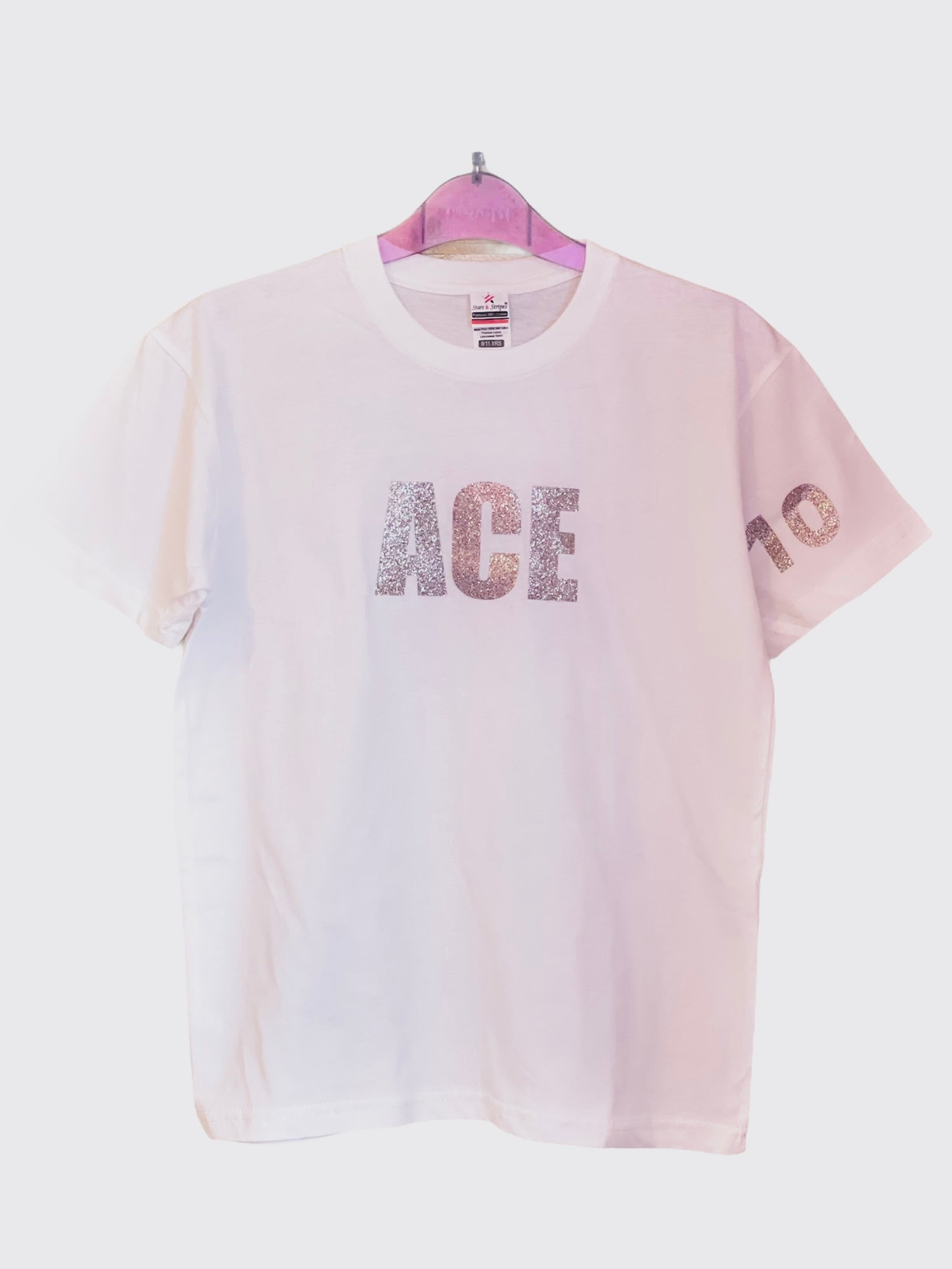 Women's white T-shirt with pink glitter logo and star